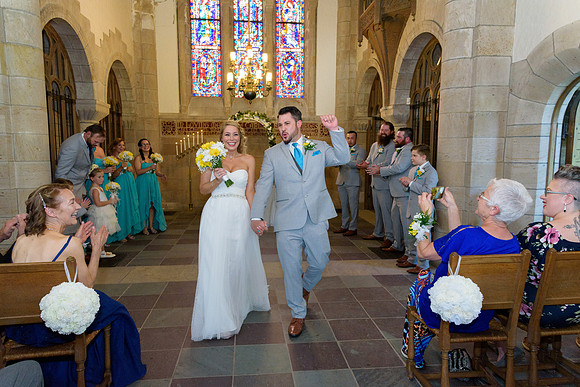 Bride and groom walking down the aisle Carlyle Barnes Memorial Chapel, Bristol, Connecticut
