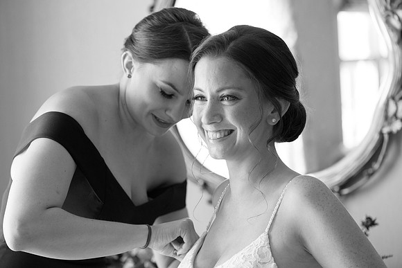 Bride getting ready photo with maid of honor at Saybrook Point Inn, Old Saybrook, Connecticut
