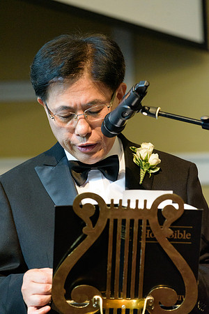 Father of the bride giving a reading for his daughter's wedding ceremony