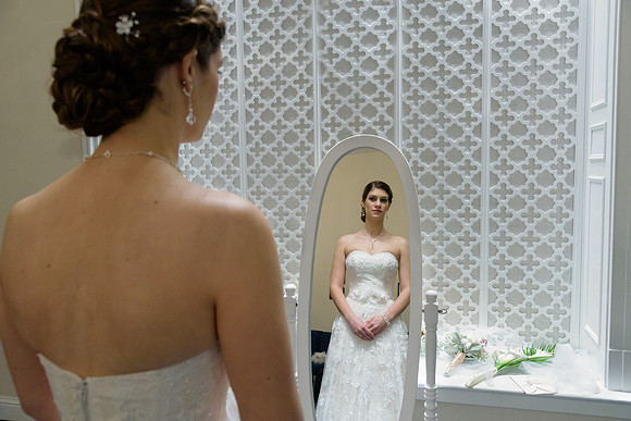 Bride looking in the mirror for her getting ready shots Connecticut Wedding