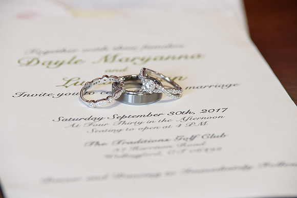 Wedding rings and invitation for getting ready shots