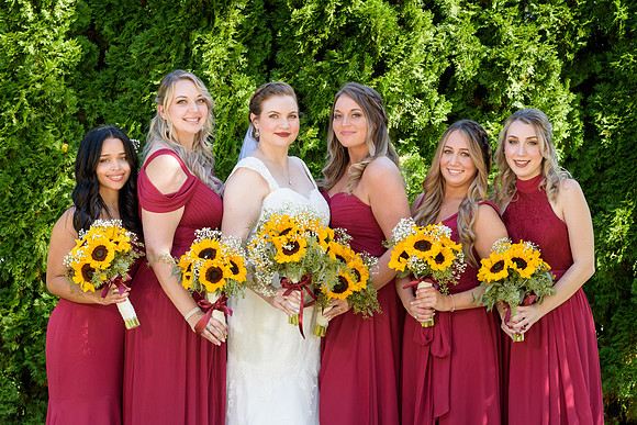 Bridesmaids in red dresses and sunflowers, The Waterview wedding venue, Monroe, Connecticut