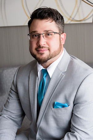 Groom in window light, getting ready photos, Connecticut