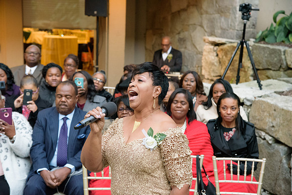 Mother of the groom singing a song, wedding ceremony at The Heritage Hotel in Southbury, Connecticut