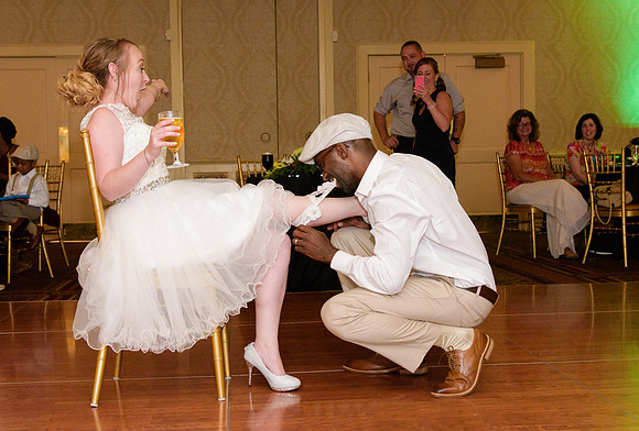 Taking off garter at Saint Clements Castle in Portland Connecticut