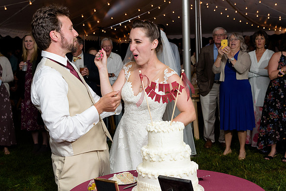 Bride and groom cutting the cake, tent wedding, Goshen, Connecticut