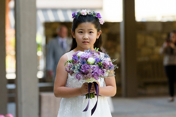 Flower girl in wedding ceremony procession at the Heritage Hotel in Southbury, Connecticut