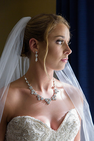 Bride getting ready portrait with window light