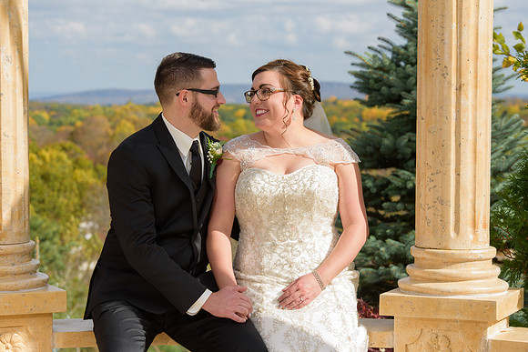 Bride and groom portraits at Aria with fall foliage colors
