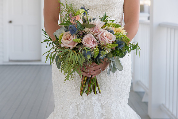 Bride and flowers portrait at the Mystic Yacht Club Ocean Blue Catering, Mystic Connecticut