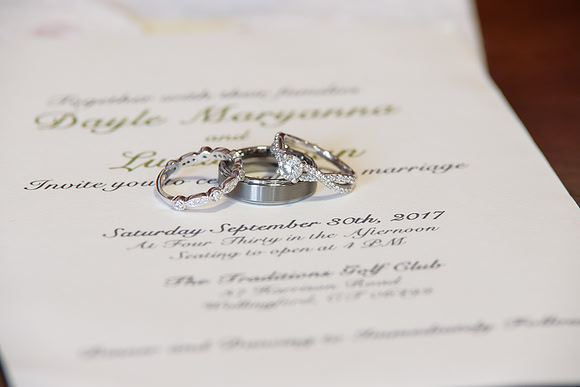 Wedding rings and invitation for getting ready shots