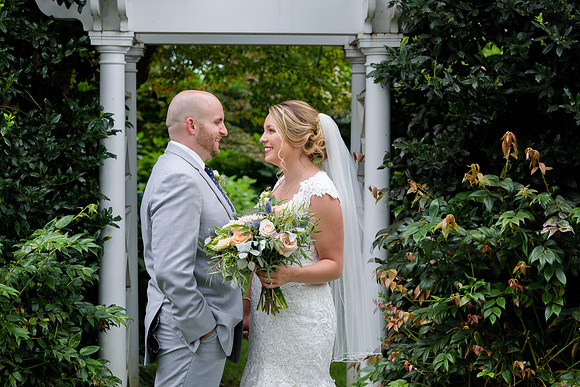 Bride and groom portraits at Stonnington Connecticut Garden with pergola