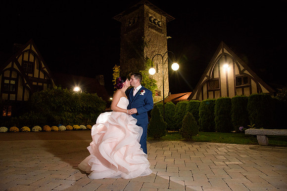 Bride in pink wedding dress night photo at Saint Clements Castle Wedding in Portland Connectiicut