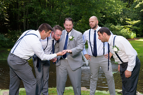 Groomsmen, checking out the ring at Wickham Park in Manchester, Connecticut Wedding Portraits