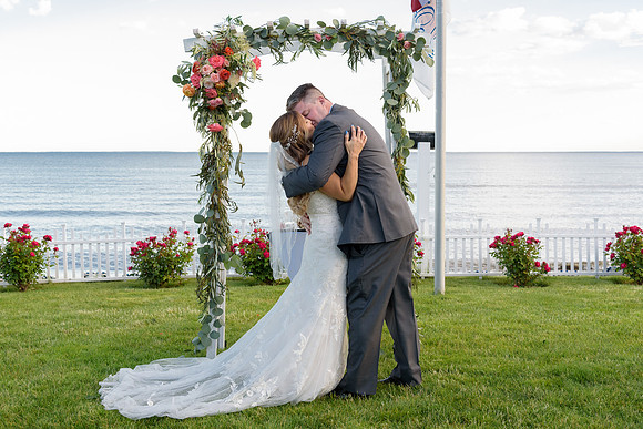 Bride and Groom, first kiss as husband and wife, Water's Edge Wedding ceremony, Westbrook Connecticu