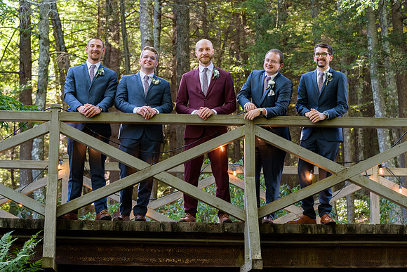 Groomsmen on a bridge in the forest in New Hartford, Connecticut