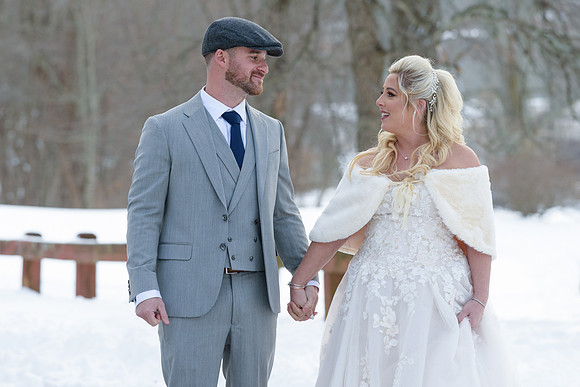 Bride and groom in the snow. Winter Wonderland Dickens Wedding