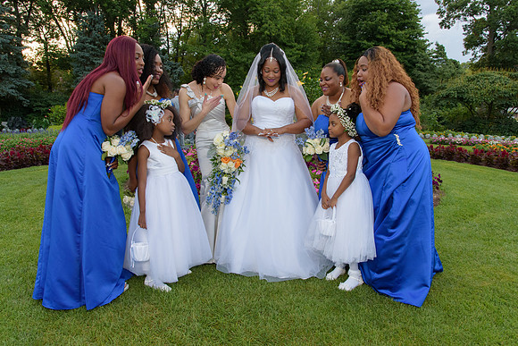 Brides maids admiring bride's ring at Elizabeth Park